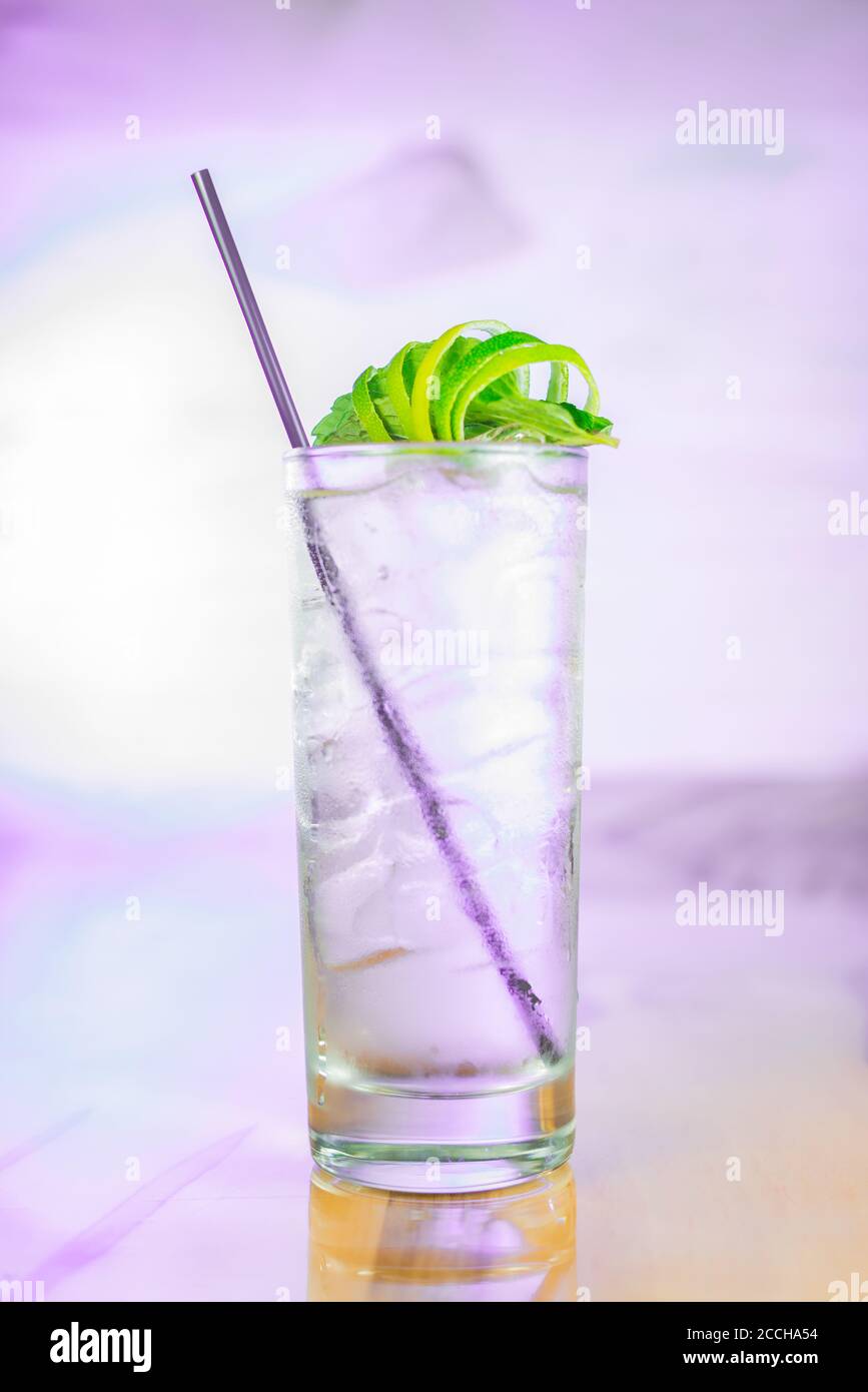 Freshmaker Cocktail A refreshing craft cocktail in Collins glass with straw and lime cage ...