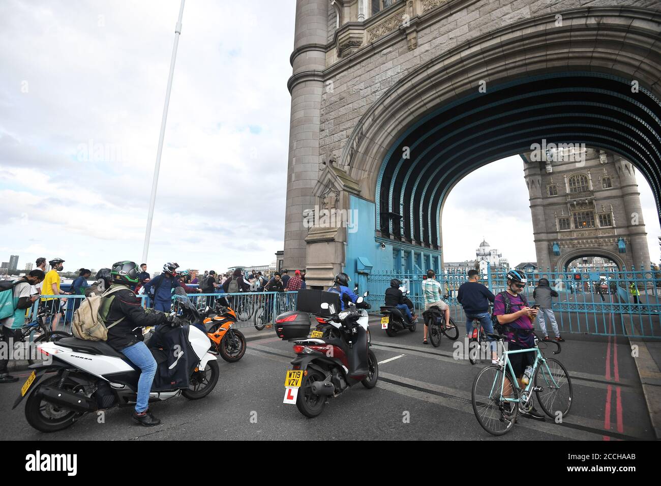 Traffic and pedestrians waiting on the approach to Tower Bridge in London, after the bridge became stuck open, causing traffic chaos. Stock Photo