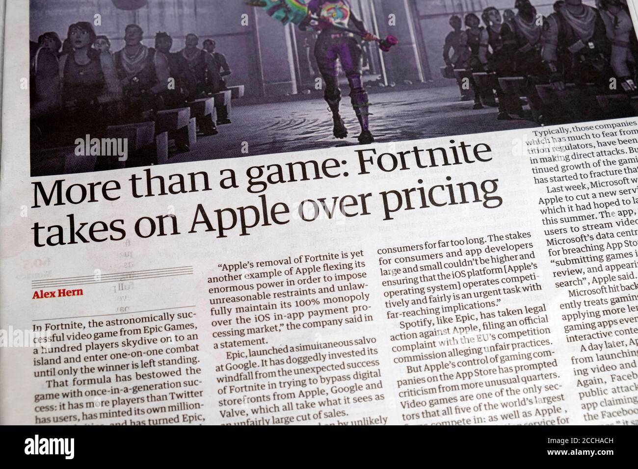 'More than a game: Fortnite takes on Apple over pricing' Guardian newspaper headline inside article in August 2020 London England UK Stock Photo