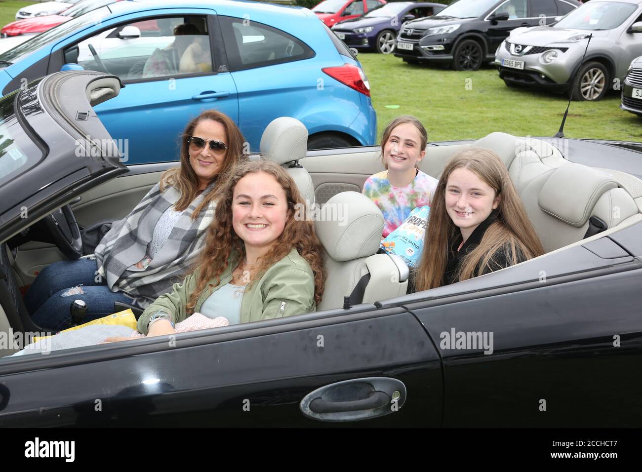 Ayr, Ayrshire, Scotland, UK, 22 August 2020 : Drive in movies come to Rozelle Park in Ayr. Families watching Grease starring John Tavolta & Oliva Newton John from the comfort of their cars  Alister Firth / Alamy Life News Stock Photo