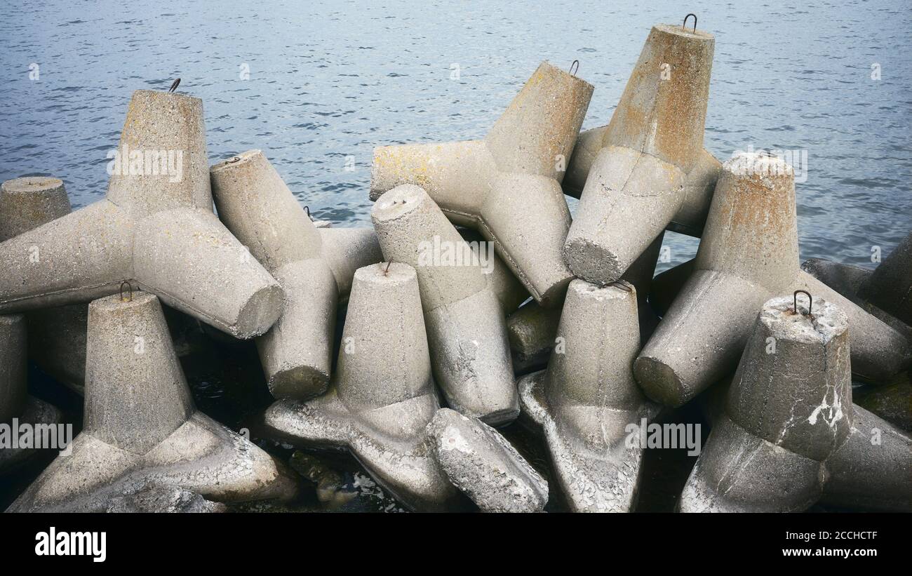 Picture of old coastal concrete breakwater tetrapods. Stock Photo