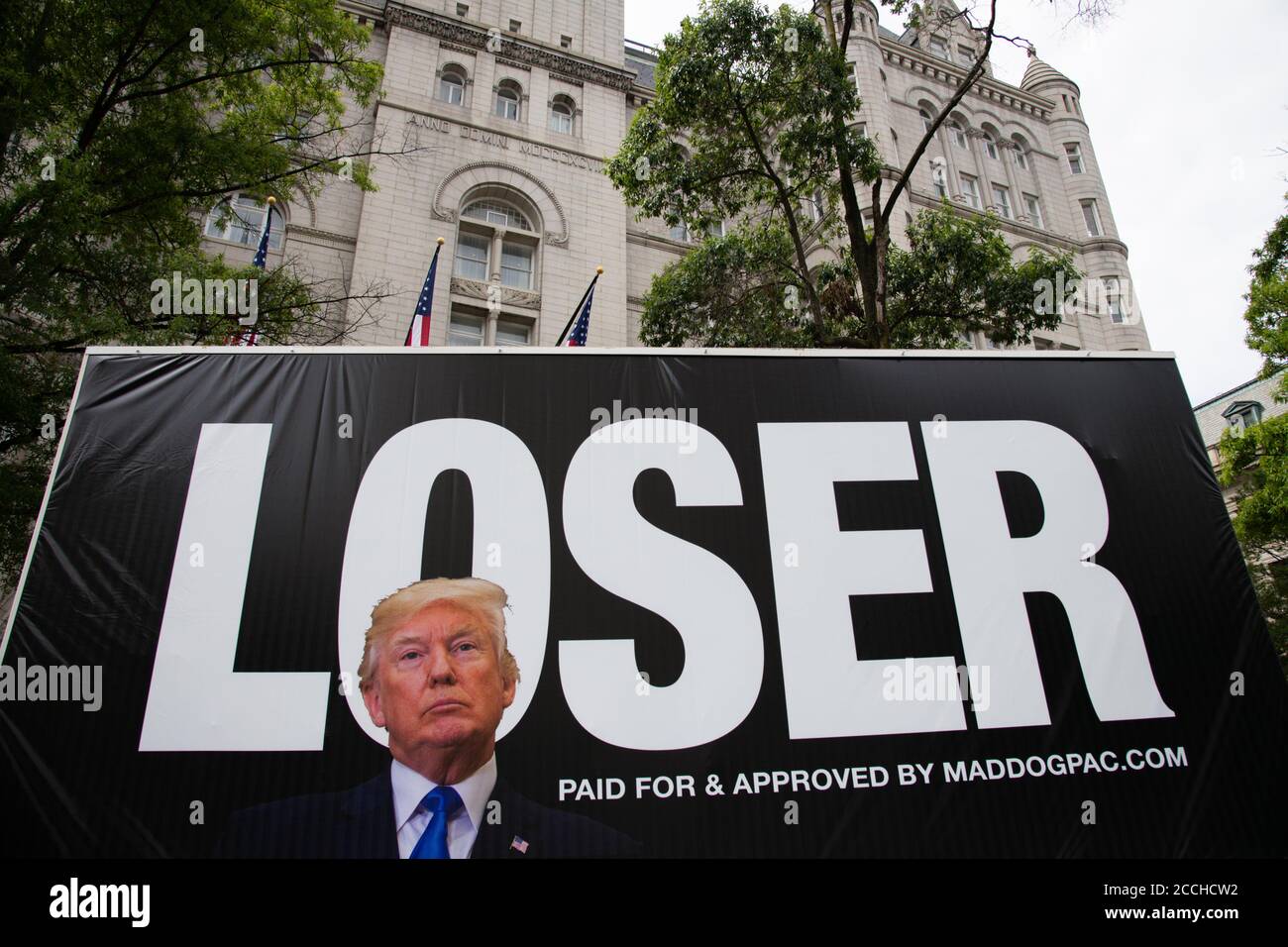 a-mobile-billboard-truck-with-a-sign-that-reads-loser-with-president-trumps-face-superimposed-on-it-is-seen-at-a-protest-against-changes-to-the-us-postal-service-usps-in-front-of-the-trump-international-hotel-in-washington-dc-on-august-22-2020-amid-the-coronavirus-pandemic-dozens-of-protesters-with-moveon-and-other-groups-gathered-at-the-old-post-office-building-currently-occupied-by-the-trump-international-hotel-on-the-same-day-speaker-nancy-pelosi-in-a-rare-move-called-the-house-of-representatives-back-from-august-recess-to-vote-on-postal-service-legislation-graeme-sloan-2CCHCW2.jpg