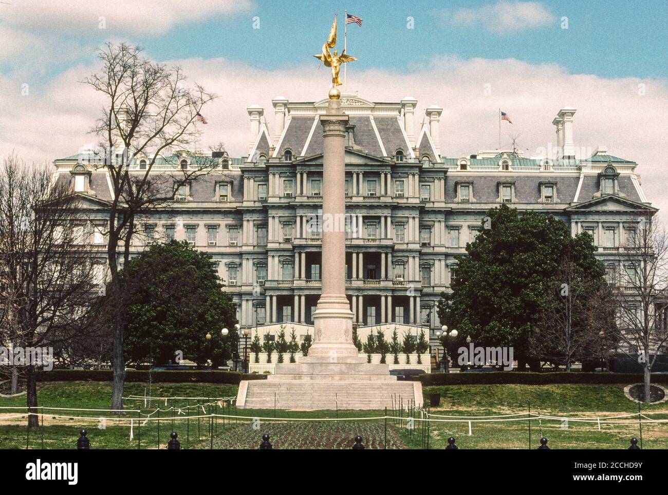 Eisenhower Executive Office Building,formerly known as the Old Executive Office Building,  even earlier as the State, War, and Navy Building, Washington DC.  The monument is the First Division Monument, to veterans of the U.S. Army's First Division. Photographed March 2006. Stock Photo