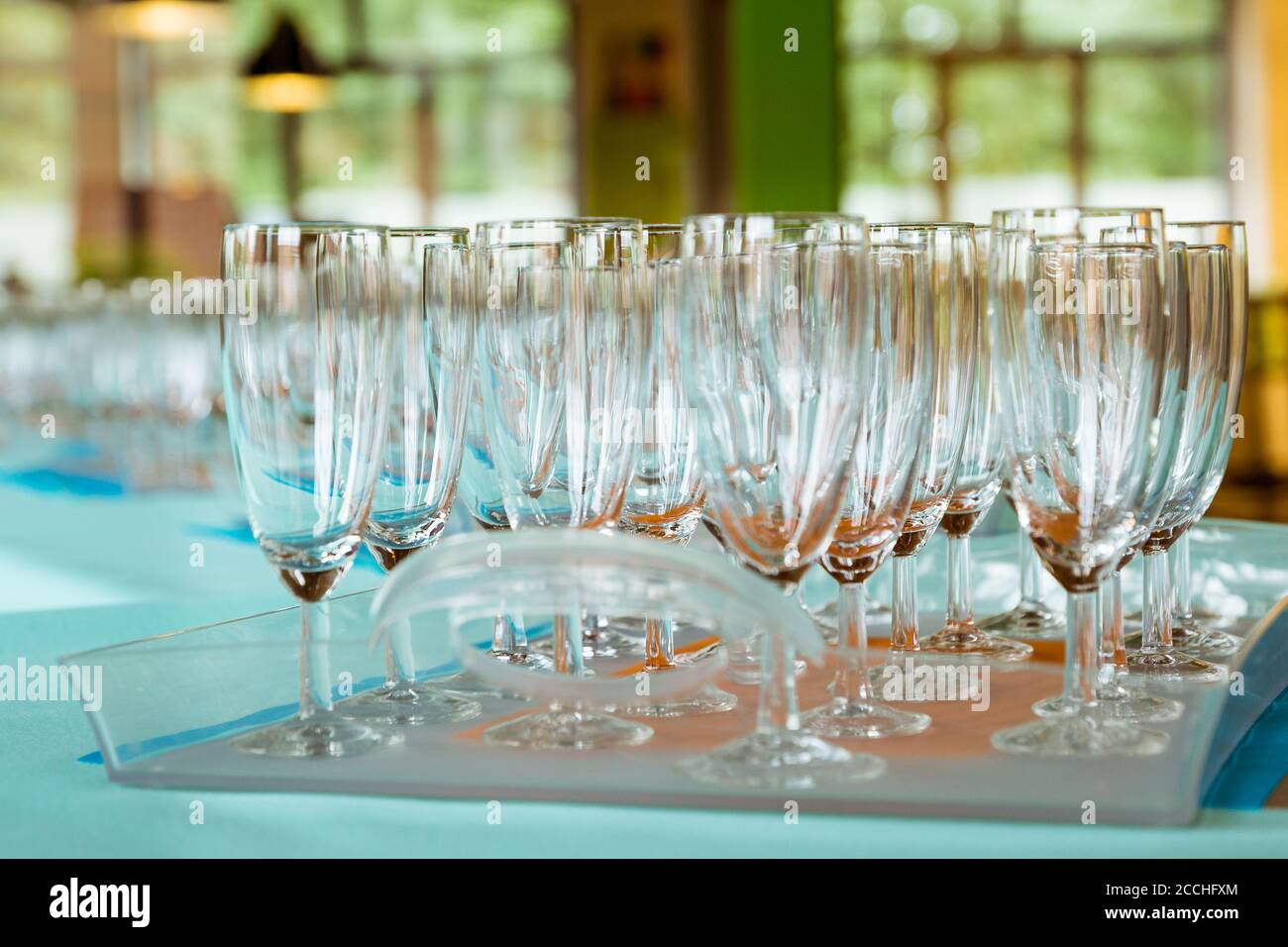 Tray with empty champagne glasses ready to be filled when the party starts Stock Photo