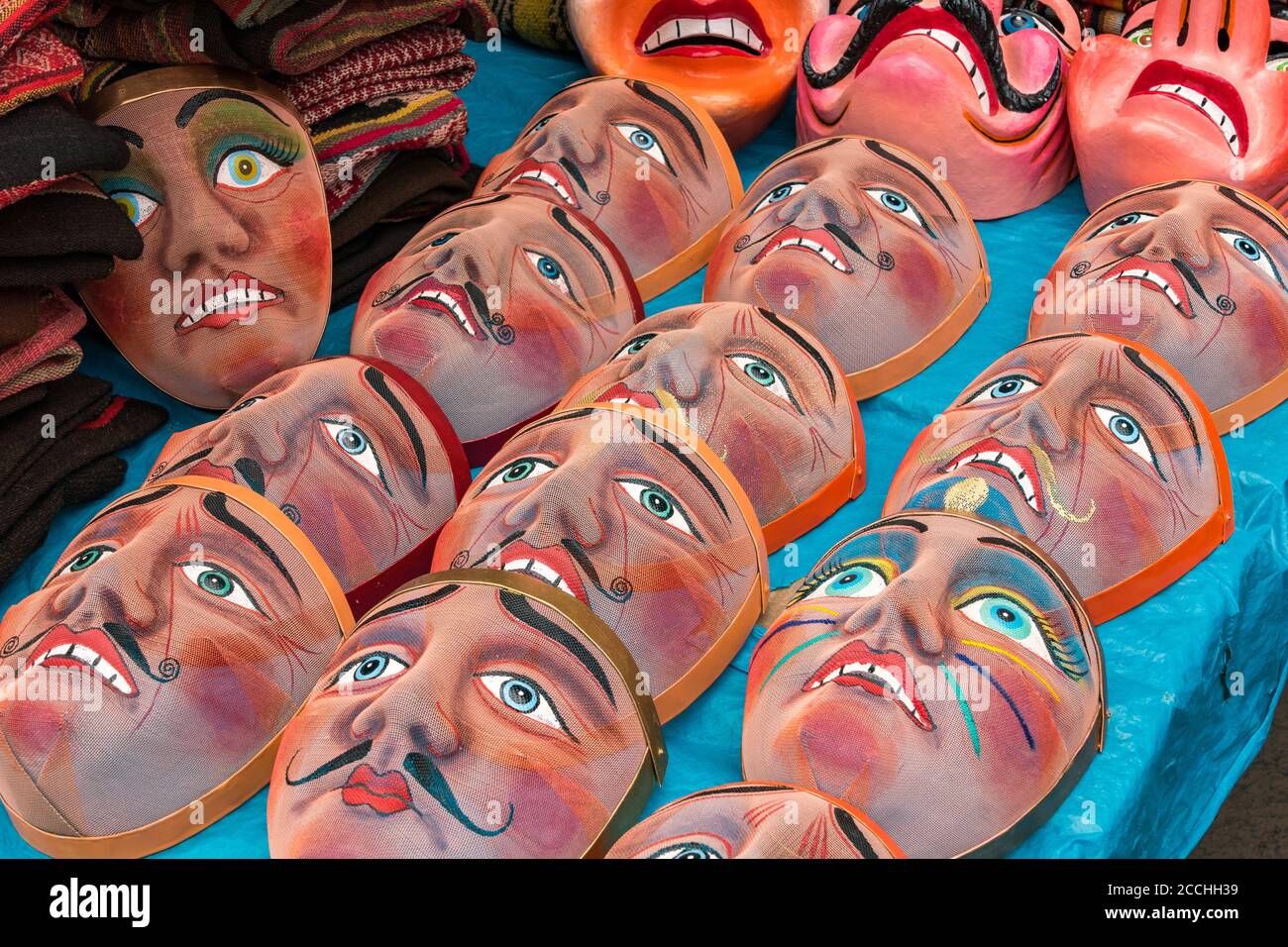 Traditional festival masks in the craft market of Pisac, near Cusco, in