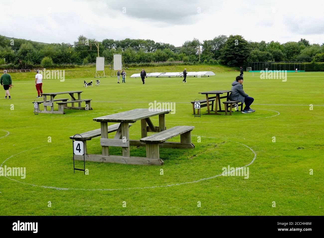 Tables at Glossop Cricket Club are spaced out at two metres to help prevent the spread of the coronavirus, which has been affecting the country for at. Stock Photo