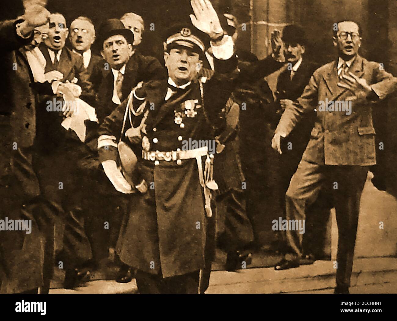May 8th 1932 - Part of the official party react in horror at the assassination of the French President   by Dr   Paul Gorguloff, a mentally unstable Russian immigrant . --- Joseph Athanase Doumer, commonly known as Paul Doumer (1857 – 1932), was the President of France from 13 June 1931 until his assassination in Paris. He was visiting Paris for the opening of a book fair at the Hotel Salomon de Rothschild. He is the only French president to die of a gunshot wound. Stock Photo