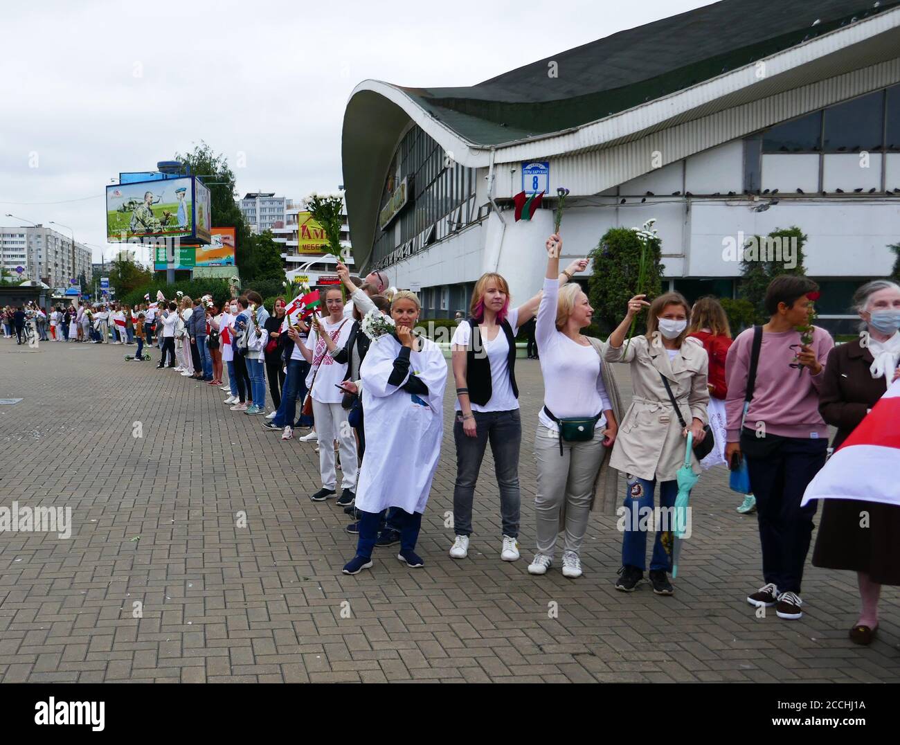 Minsk, Belarus - August 22, 2020. People holding flowers during peaceful protests. Minsk, Belarus. Protesting against dictator Lukashenko. Stock Photo