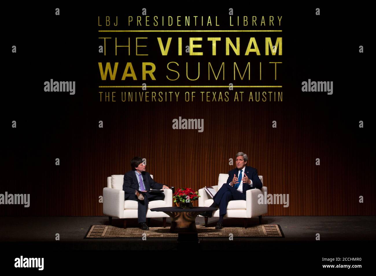 U.S. Secretary of State John Kerry, right, a Vietnam War veteran, speaks with documentary filmmaker Ken Burns during a conversation about the Vietnam War at the LBJ Presidential Library April 27, 2016 in Austin, Texas. Stock Photo