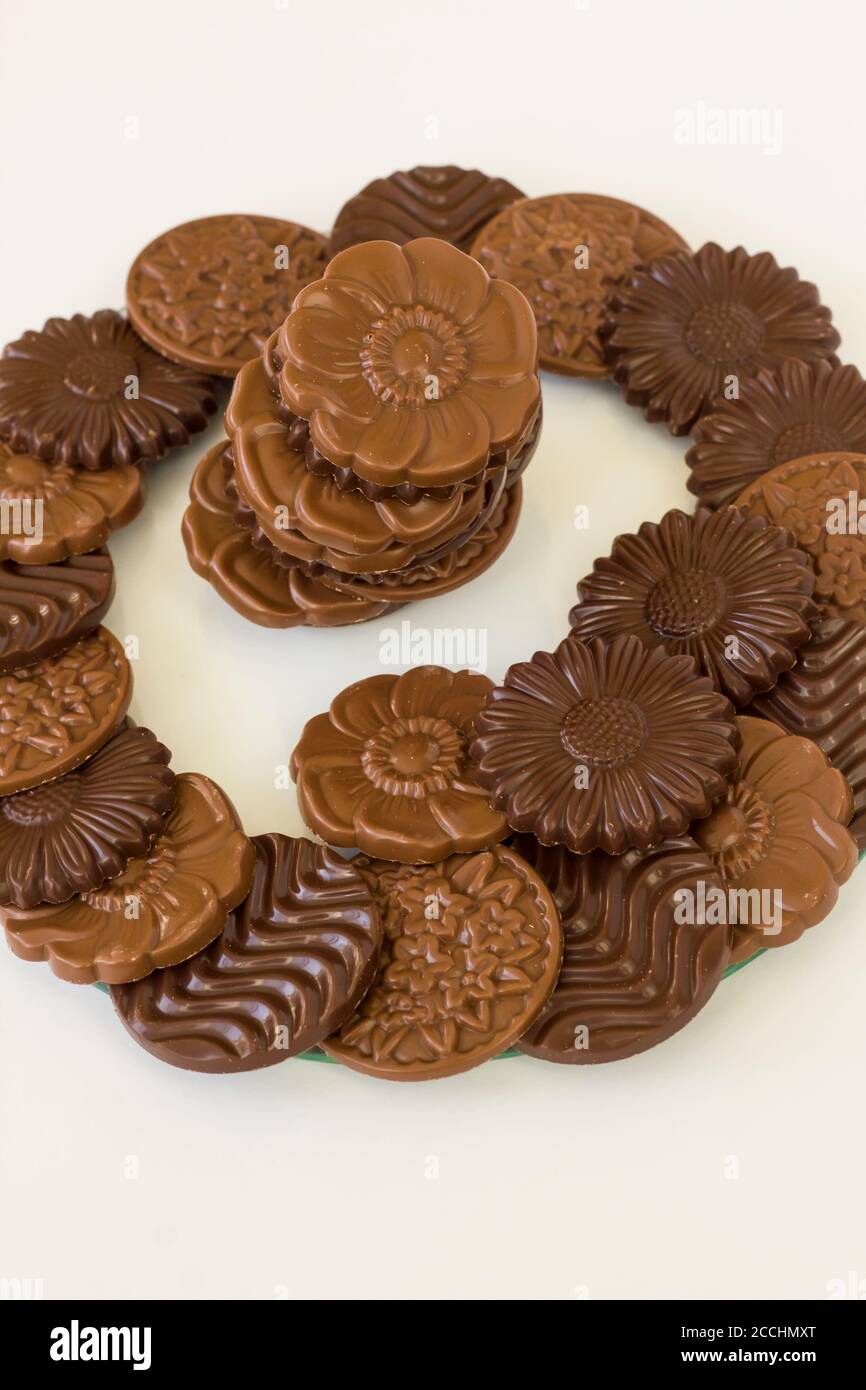Milky and bitter round shape chocolate Madlen,designed on glass plate.The Sugar Feast or any festival celebration. Stock Photo