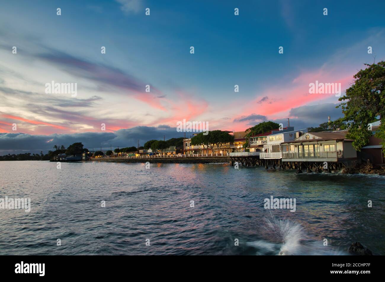 View of downtown Lahaina on Maui from Lahaina harbor at sunset. Stock Photo