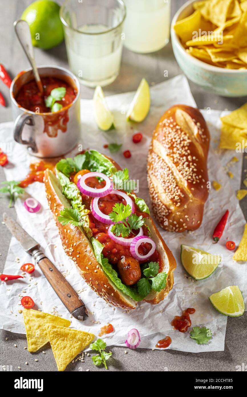 Spicy barbecue hot dogs with red sauce and coriander Stock Photo Alamy