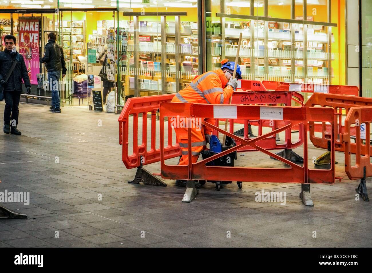 Person wearing red jacket hi-res stock photography and images - Alamy