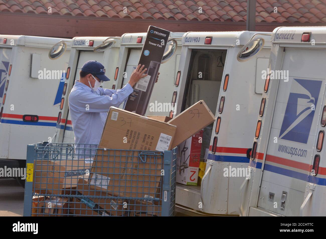 Hollywood, California, USA. 22nd Aug, 2020. Postal workers load up their trucks for Saturday's mail delivery at the Sunset Post Office in the Hollywood section of Los Angeles on Saturday, August 22, 2020. A coalition of activists declared a "day of action" today aimed at saving the U.S. Postal Service, with nearly 700 rallies planned nationwide. Credit: UPI/Alamy Live News Stock Photo