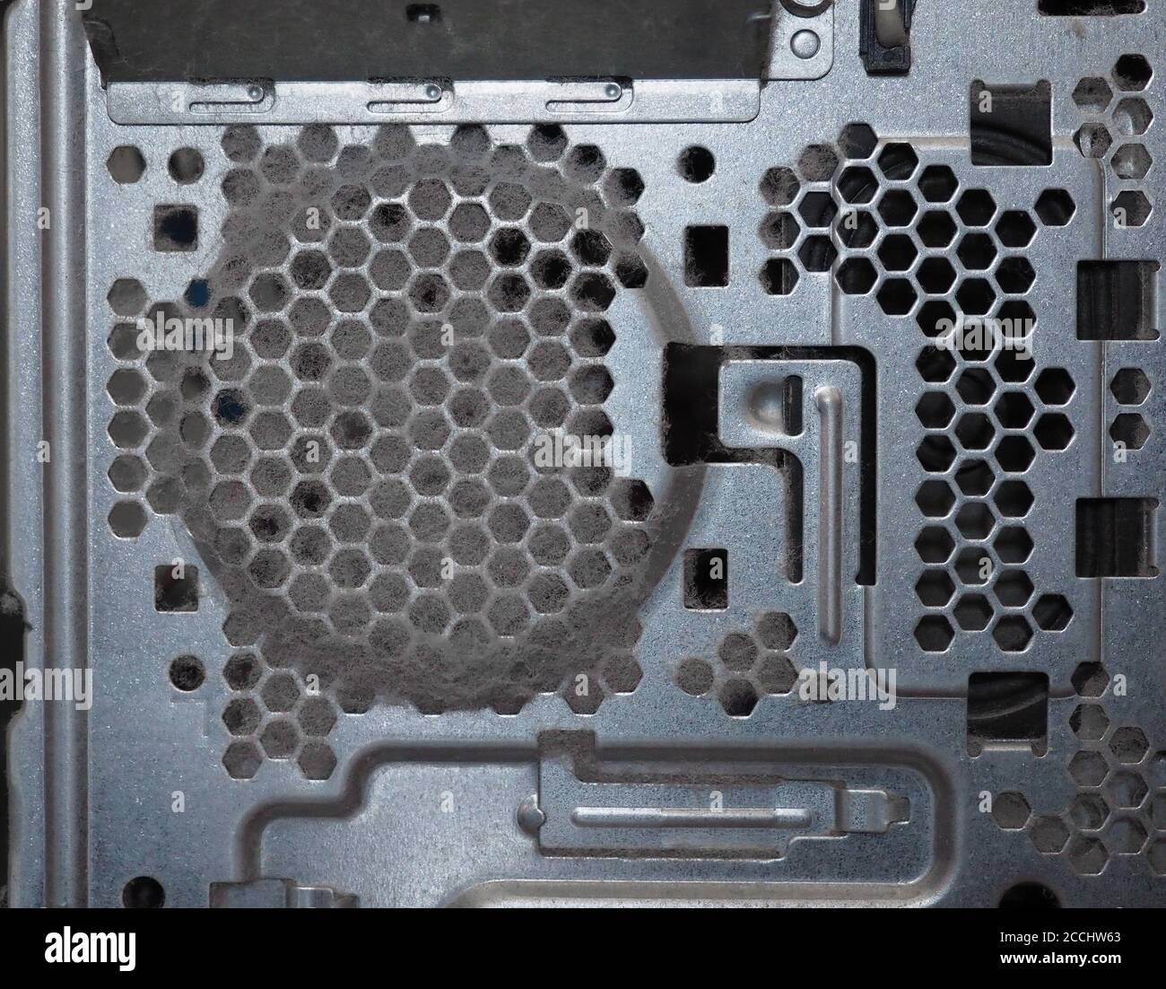 dust on a pc computer air intake vent causing overheating Stock Photo