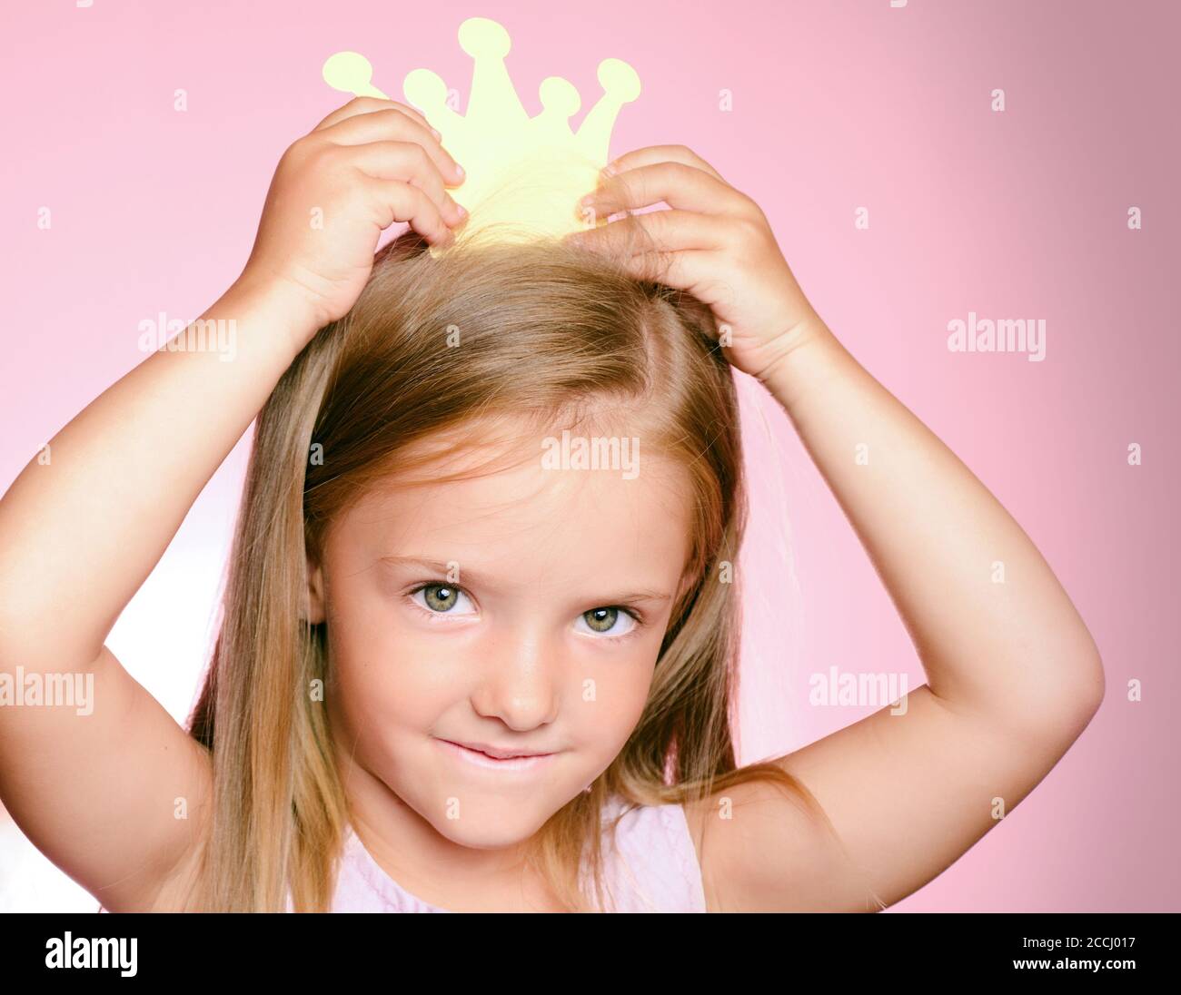 Little queen child girl with gold crown. Little princess in yellow