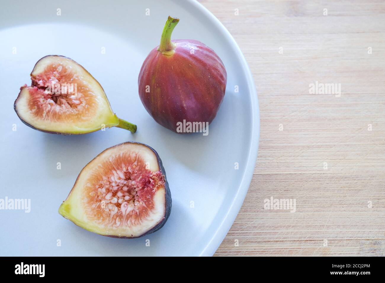 Common figs, Ficus carica , on a plate Stock Photo