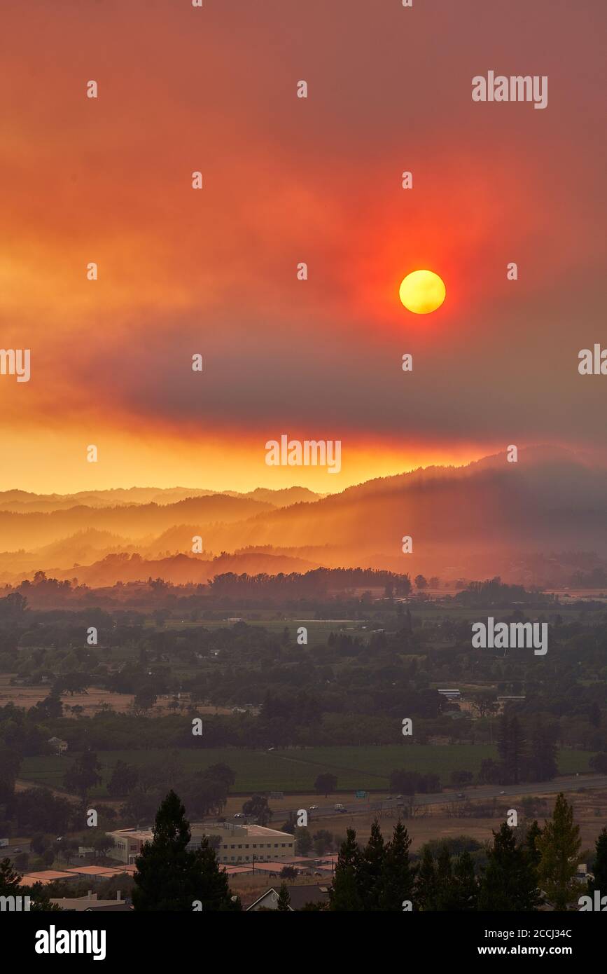 California wildfire - the Walbridge Fire in Sonoma County. smoke and red sky seen during sunset from Santa Rosa, California. Stock Photo