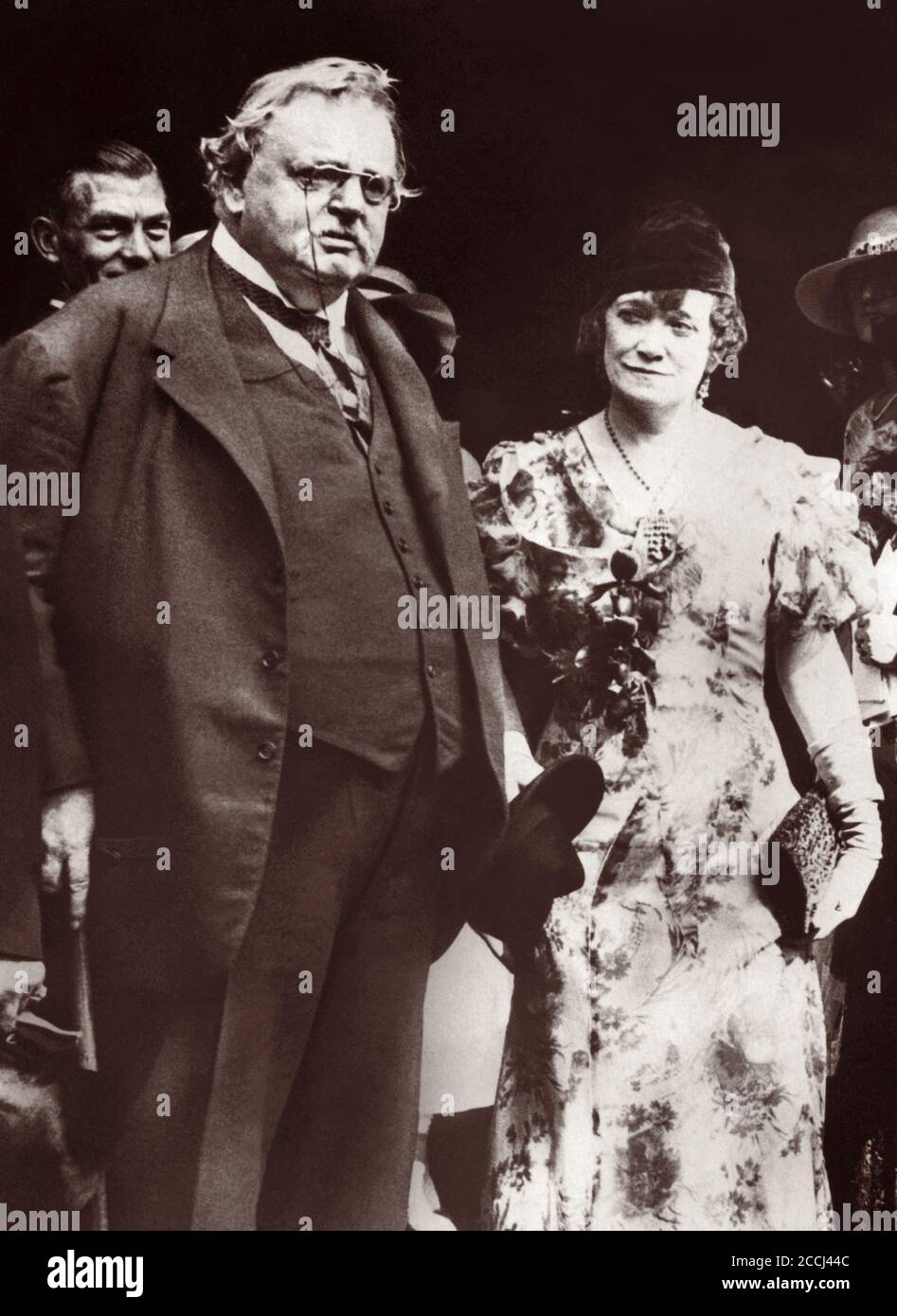 G.K. Chesterton and his brother Cecil's wife, Ada, after the wedding ceremony of Ada's secretary, Miss Dunham, to G.H.N. Phillipps in London, England, September 4, 1933. Stock Photo