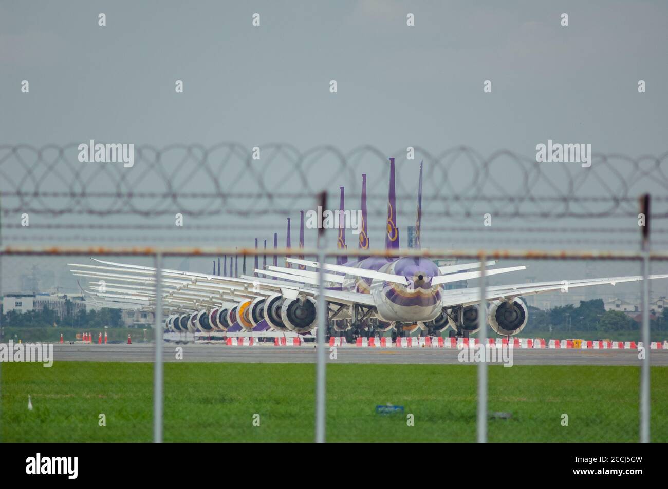 Bangkok, Thailand - August 23, 2020: Widebody airplanes belonging to the bankrupt Thai Airways being stored at Suvarnabhumi Airport during the Covid-1 Stock Photo