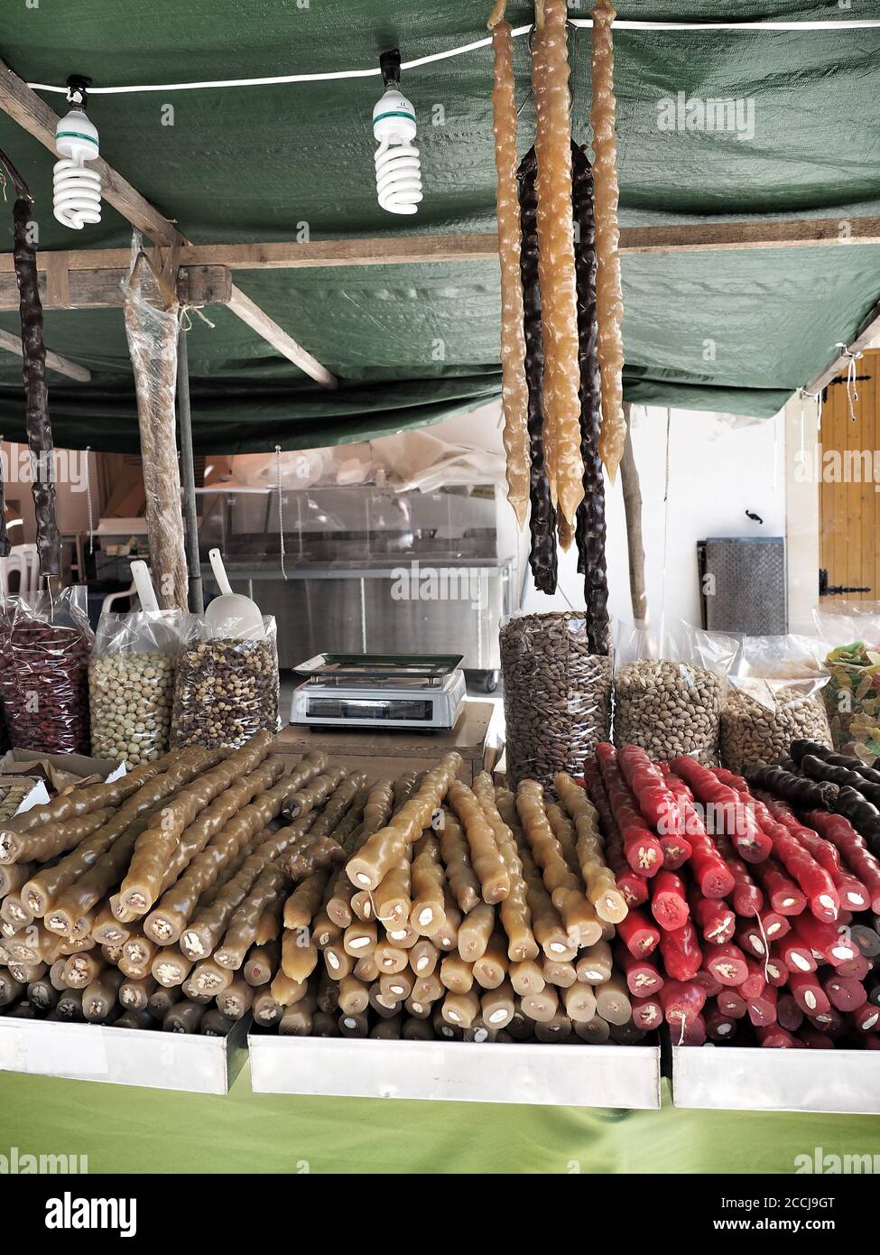 Sujuk, traditional sweets of Cyprus made from grape, honey and walnuts on market.  Stock Photo