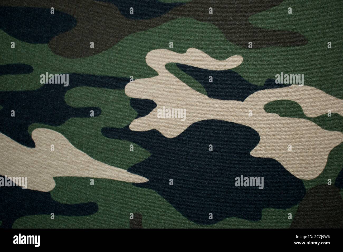 Military camouflage fabric, cloth background Stock Photo