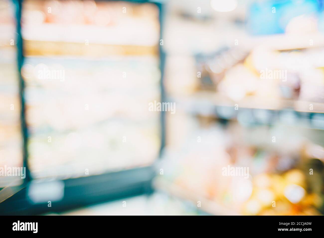 Abstract blurred row of goods on shelf in supermarket, Business ...