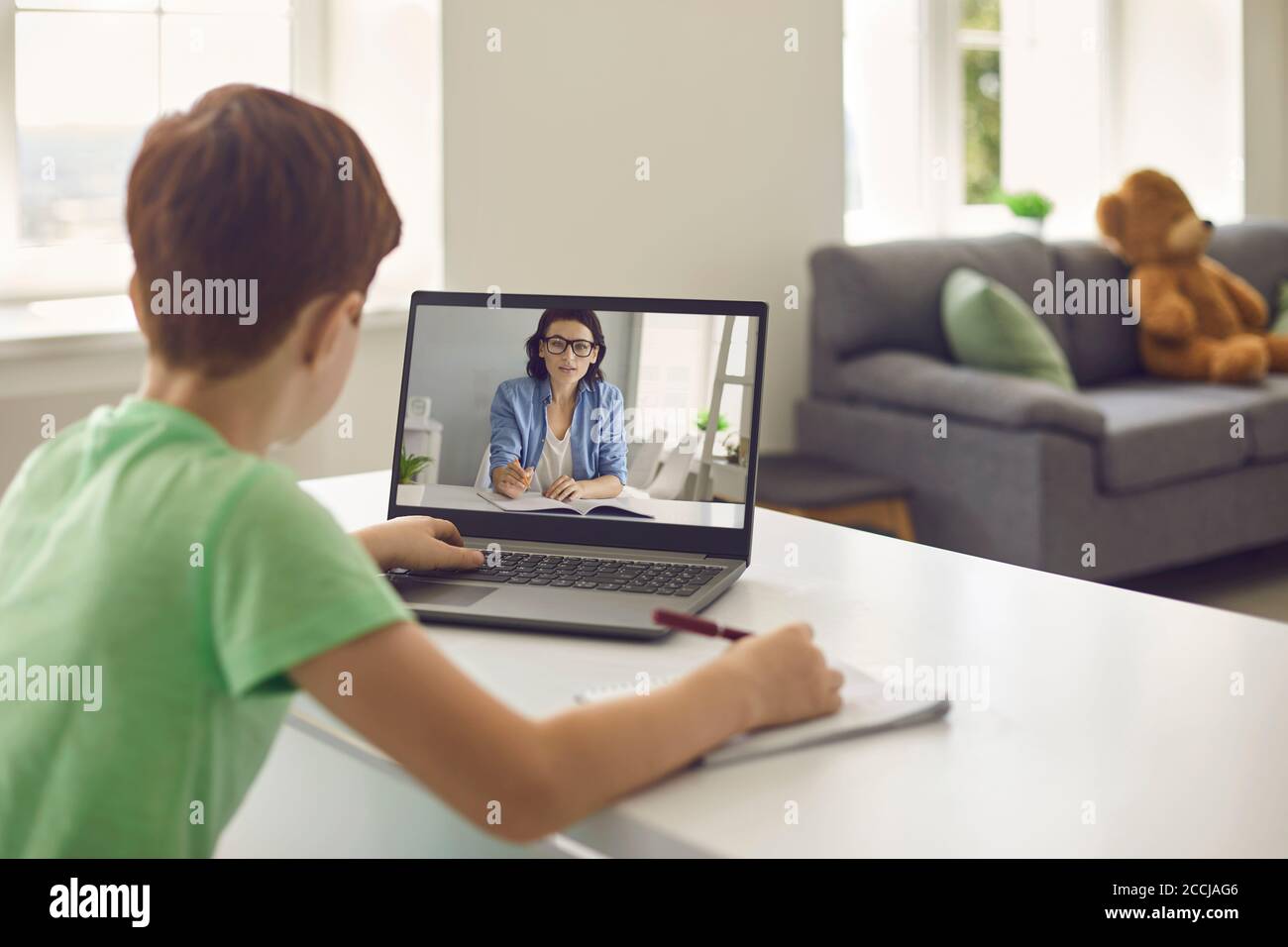 Online learning. Remote education. Home schooling. Social distance during quarantine, self-isolation. Stock Photo