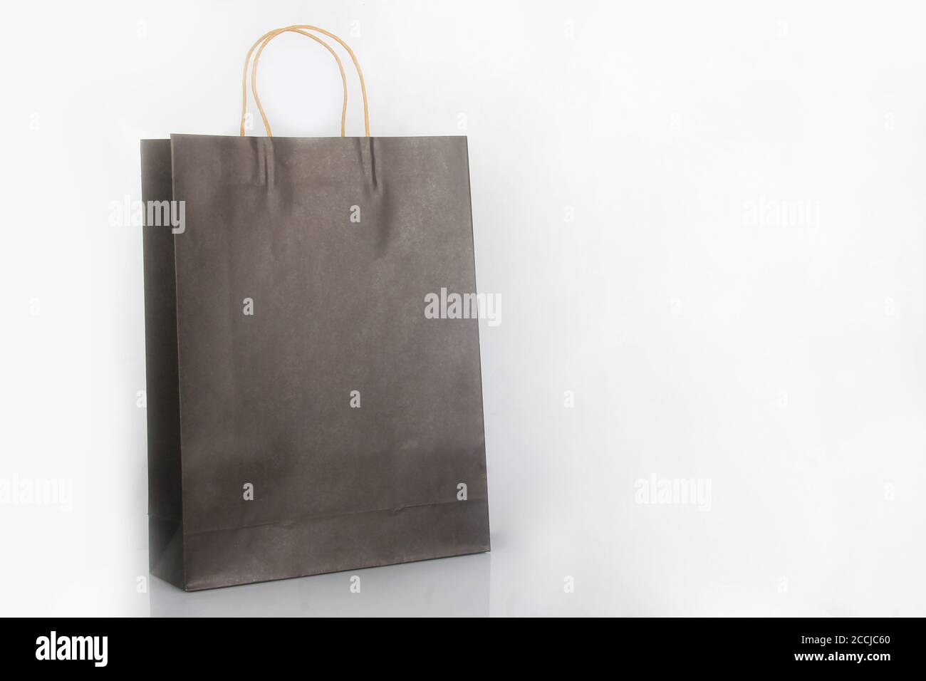Brown packaging paper bag on a white background. Paper bags for