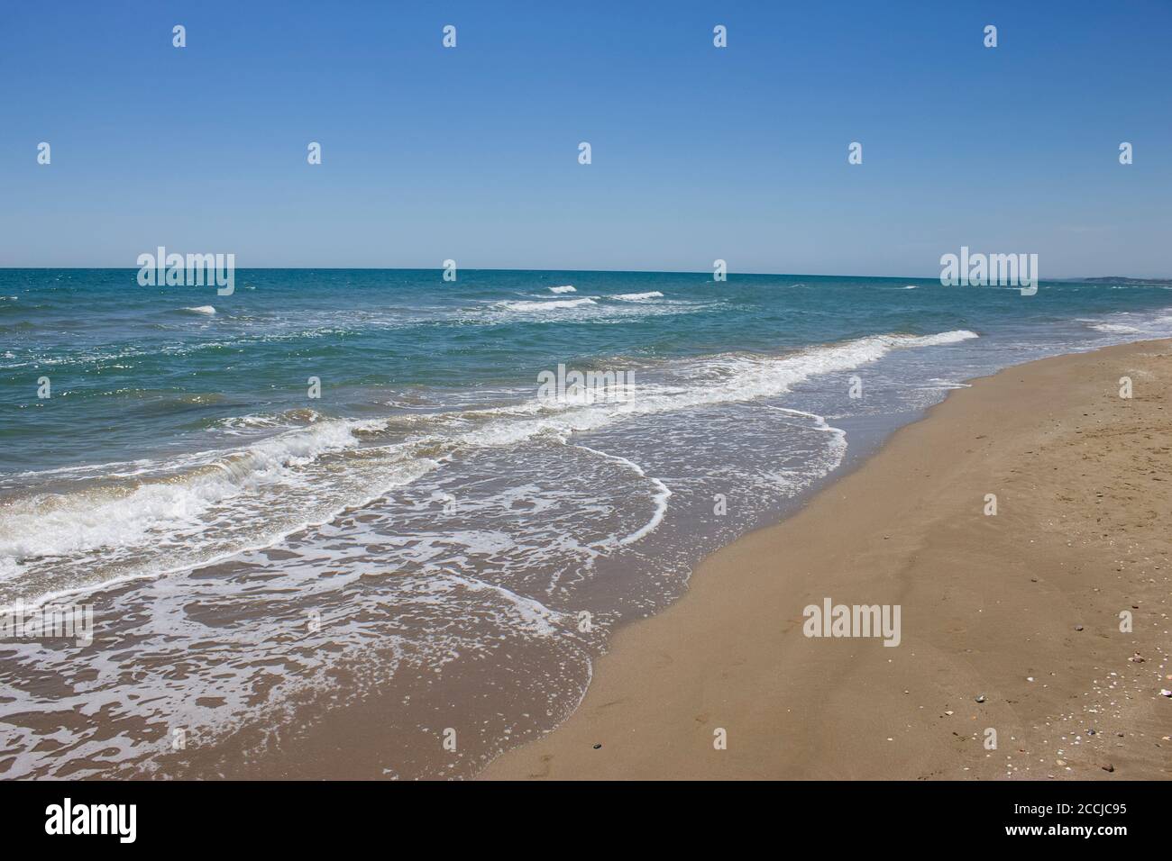 Beach view in summer ,sunny day in Calafell,Spain ,Mediterranean Sea.Empty beach no people.Travel destination.Holidays background. Stock Photo