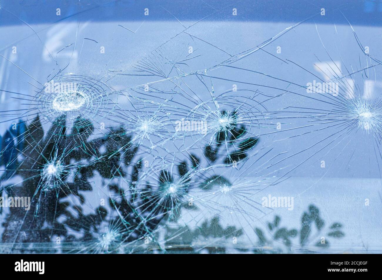 Car Glass Exploding broken glass. Car glass cracked from an accident. Armored glass after ...