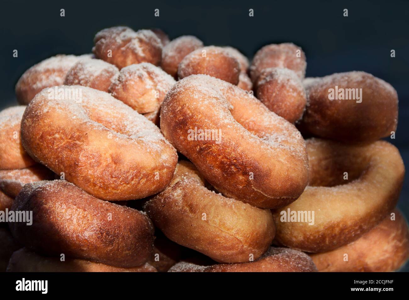 Deep fried donut with powdered sugar, background Stock Photo Alamy