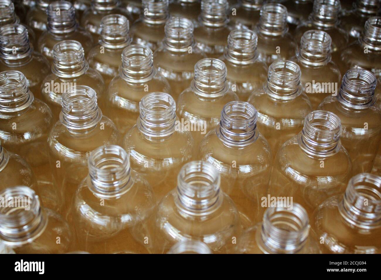Clean plastic bottles stacked in a factory Stock Photo Alamy