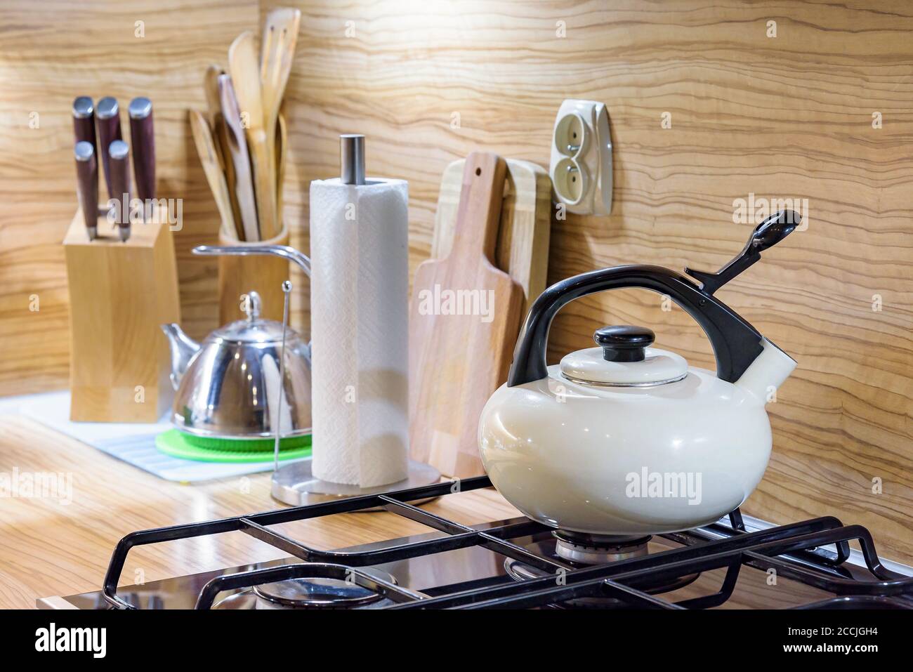 Kitchen utensils on a wooden worktop with led backlihgt Stock Photo