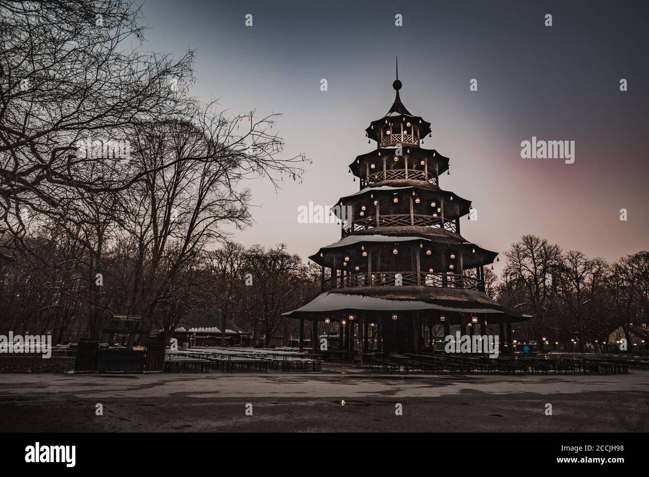 The famous wooden Chinese Tower (Chinesischen Turm) and beer Garden with its beautiful blooming horse chestnut trees in Munich Bavaria Germany. Stock Photo