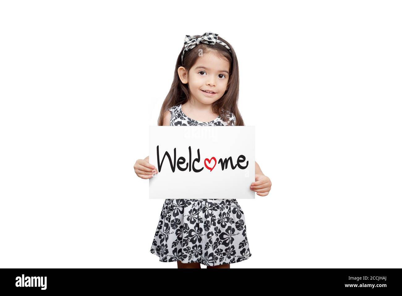 Business welcome concept, Cute girl holding a welcome sign standing on white background. Cute mixed race girl half Thai, half English model 3 years ol Stock Photo