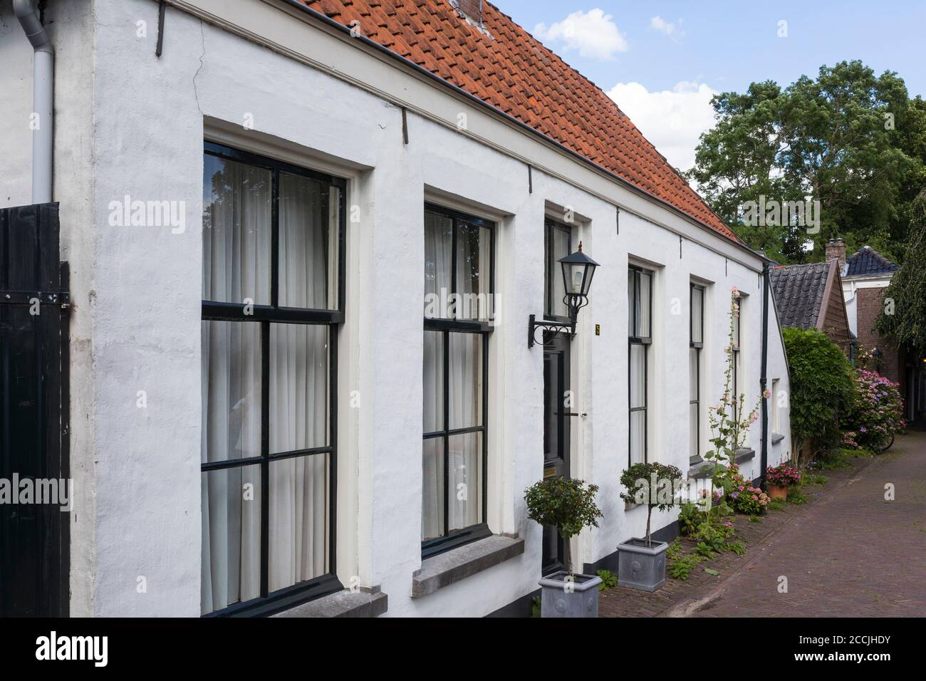 Picturesque old white houses in the old fortress city of Naarden Vesting in the Netherlands Stock Photo