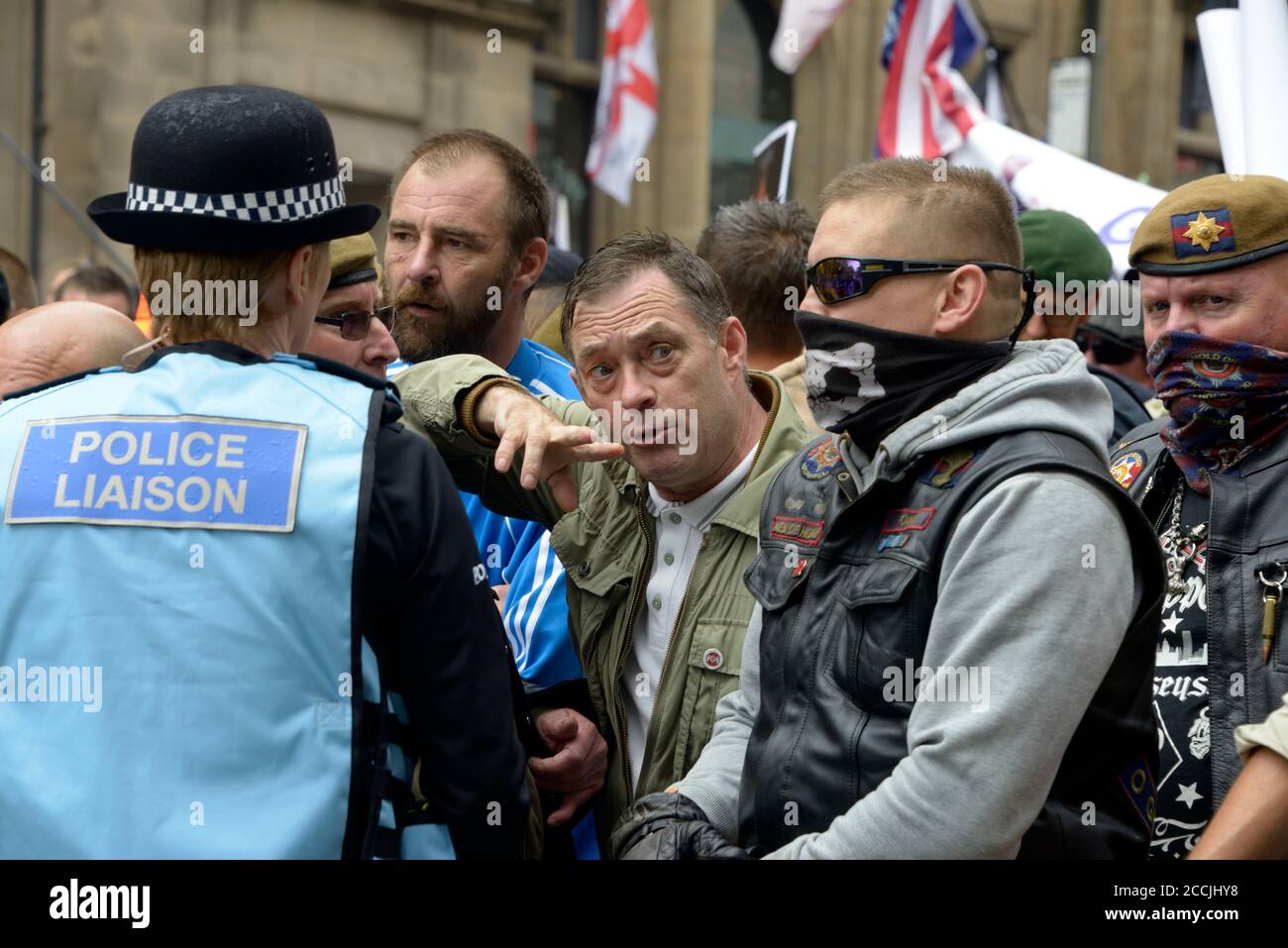 Right wing protesters, talking to police liaison, in Nottingham Stock Photo