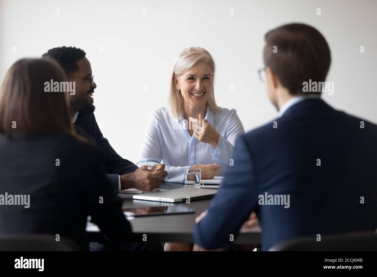 Diverse group of businesspeople holding constructive talks Stock Photo