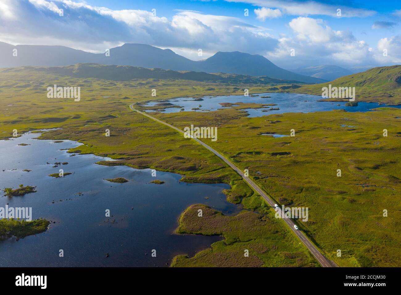 Aerial view of A82 road crossing Rannoch Moor with Loch Ba on left, in summer, Scotland, UK Stock Photo