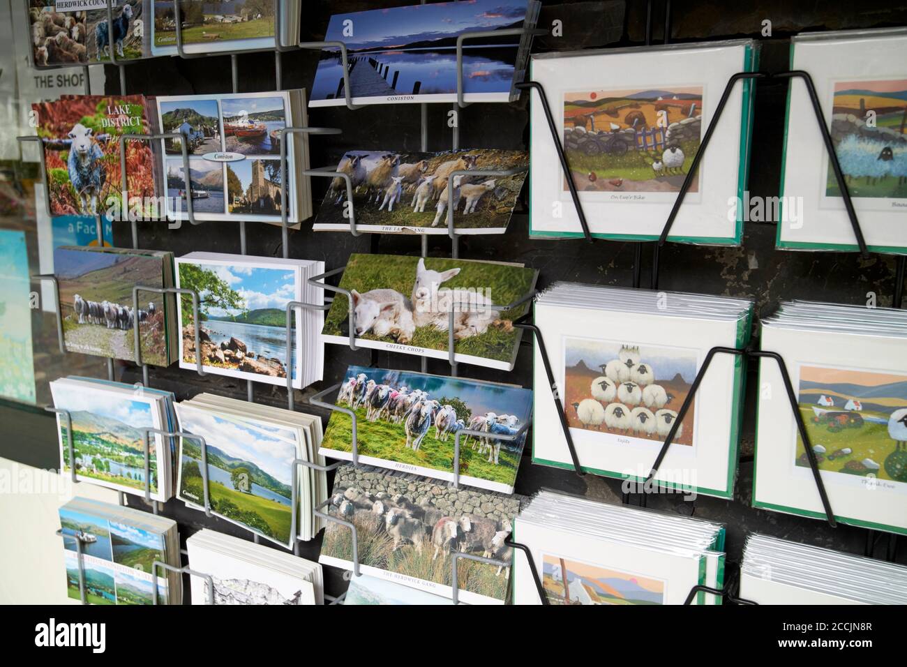 lake district postcards for sale outside a shop in coniston lake
