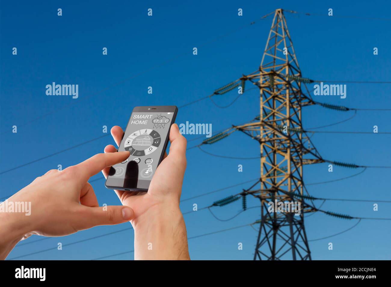 Woman Controlling Smart Plug Using App On Mobile Phone Stock Photo