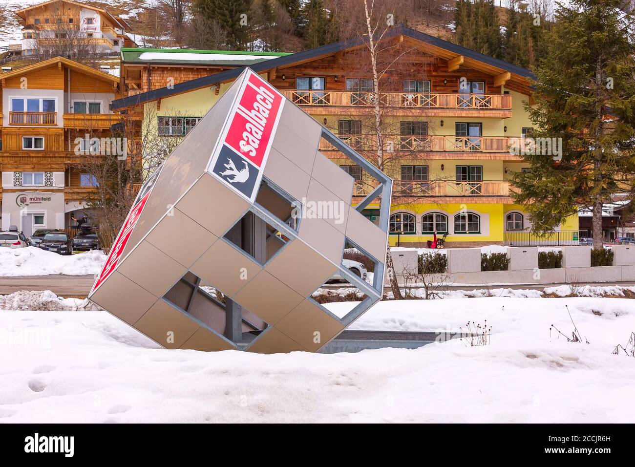 Saalbach, Austria - March 4, 2020: Cityscape in the austrian resort, big cube with name and houses Stock Photo