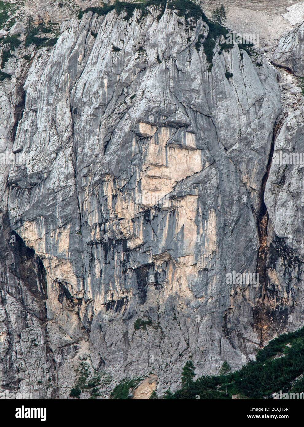The Adjovska Deklica, or Girl In The Rock, a natural rock formation on the side of Mount Prisank in Slovenia. Stock Photo