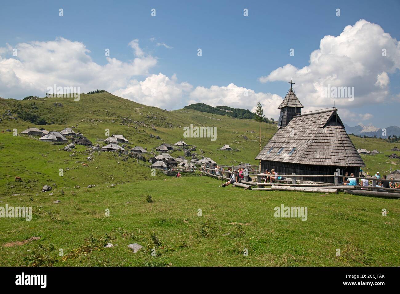 The mountain settlement village of Velika Planina in Slovenia. The village church in the foreground. Stock Photo