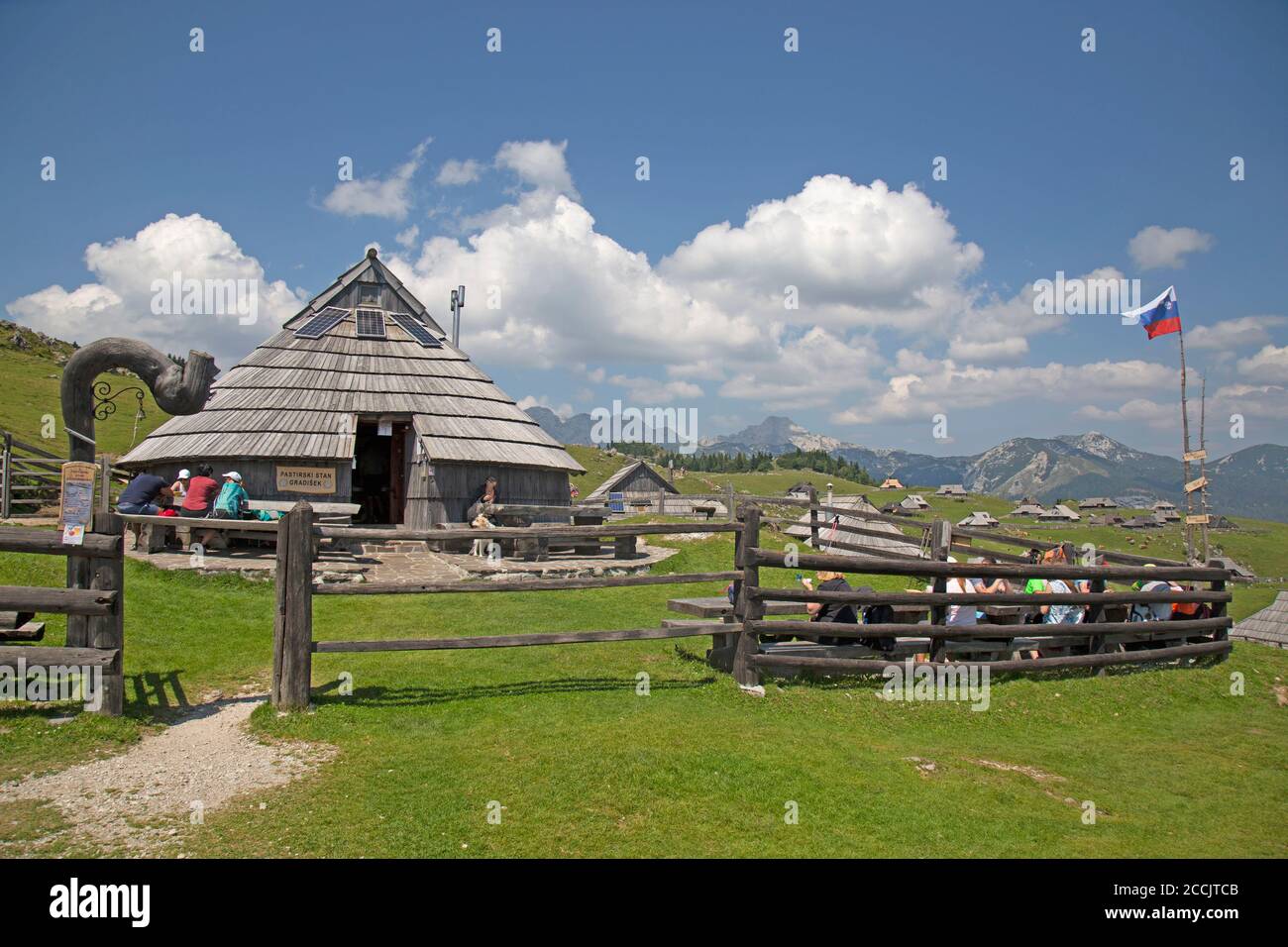A traditional herdsman hut now being used as a cafe restaurant in the mountain settlement village of Velika Planina in Slovenia. Stock Photo