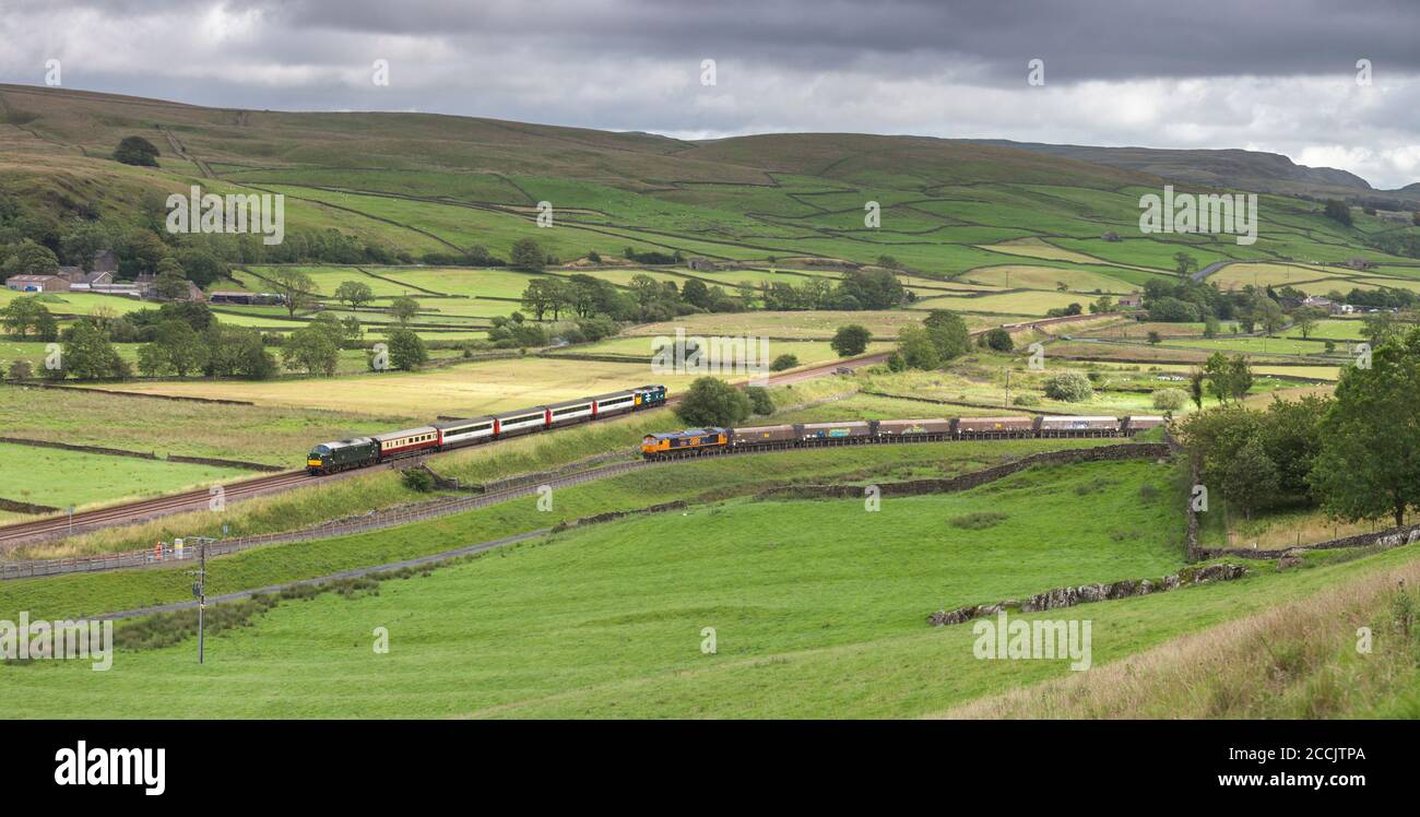 The 'Staycation Express' train passing a GBRF freight train at Helwith ...