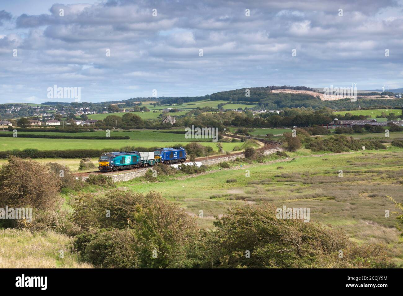 Direct rail Services Class 68 locomotive 68005 Defiant on the Cumbrian coast railway near Carnforth  with the nuclear flask train from Heysham Stock Photo