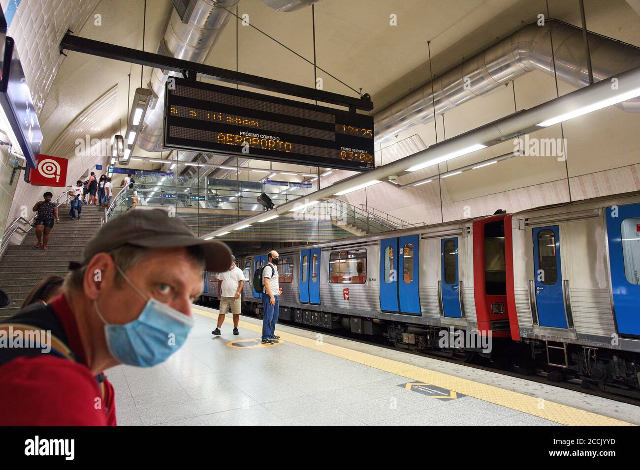 Lisbon, Lissabon, Portugal, 16rd August 2020.  Underground train with passengers and a corona sign with advice to keep distance. © Peter Schatz / Alam Stock Photo