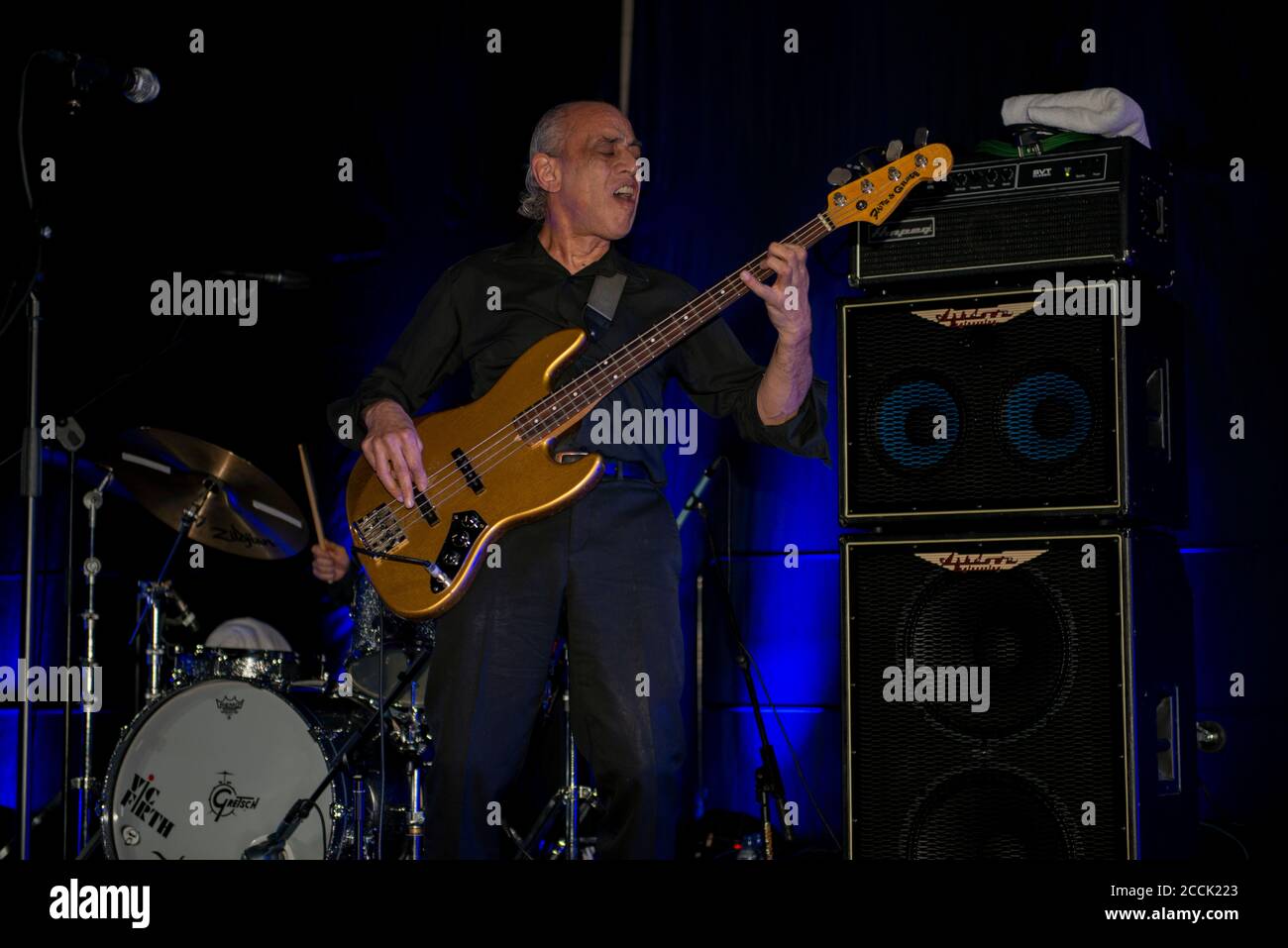 Bassist Norman Watt-Roy (ex Blockheads) with Wilko Johnson band on 'farewell Tour' after Wilko's  terminal cancer diagnosis, Wilko Johnson and guests. Doncaster Blues Festival, The Dome, Doncaster. 2 March 2014. Stock Photo